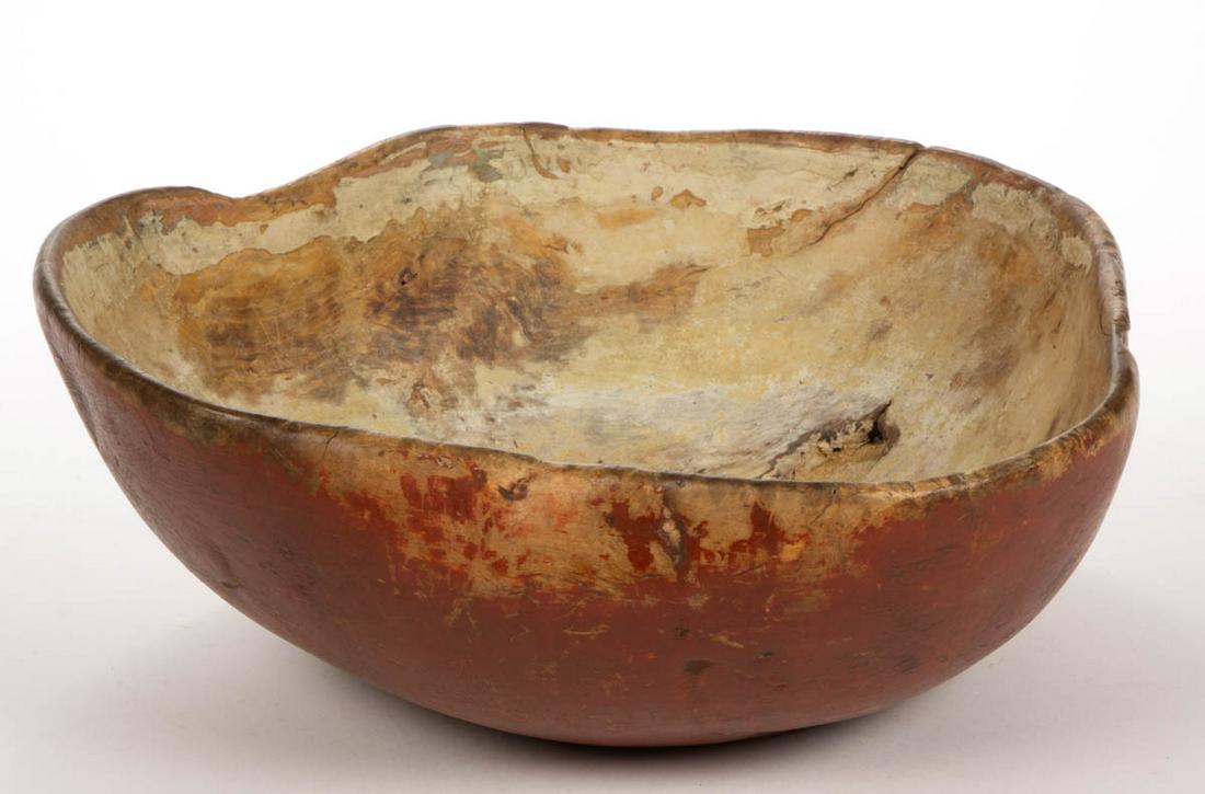 AMERICAN PAINTED BURL TREENWARE BOWL: AMERICAN PAINTED BURL TREENWARE BOWL, fine asymmetrical, organic form, retaining an early red-painted surface. Late 18th/early 19th century. 5 3/4" H, 13" W, 14" D.Very good overall condition with exp