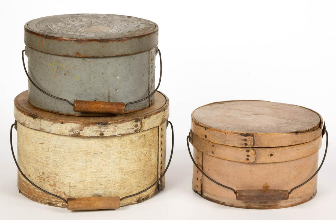AMERICAN COUNTRY PAINTED BENTWOOD PANTRY BOXES, LOT OF: AMERICAN COUNTRY PAINTED BENTWOOD PANTRY BOXES, LOT OF THREE, each covered circular form of lapped construction, with bail handle, blue-painted example stamped on the underside "S.P. BURNHAM". Each wi