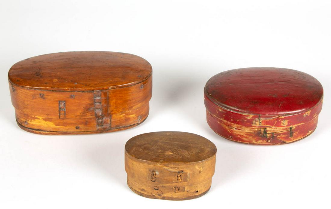 GERMANIC BENTWOOD PANTRY BOXES, LOT OF THREE: GERMANIC BENTWOOD PANTRY BOXES, LOT OF THREE, each covered oval form, including one in an old red-painted surface, and another signed to the underside "Armasjarvi /1840". 19th century. 2 1/2" to 3 1/2