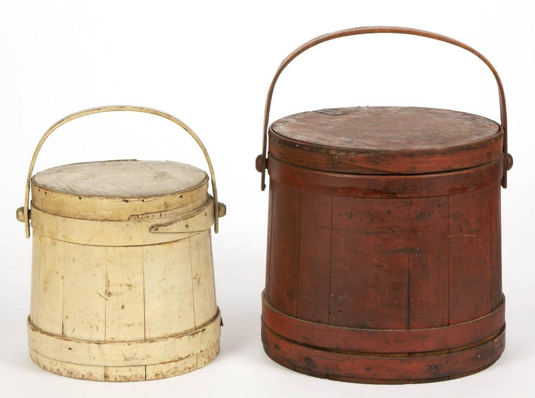 AMERICAN PAINTED TREEN SUGAR FIRKINS / BUCKETS WITH: AMERICAN PAINTED TREEN SUGAR FIRKINS / BUCKETS WITH COVERS, LOT OF TWO, each with lapped bentwood bands, and bail handle. Old red and white-painted surfaces. 19th century. 9 1/4" to 11 1/2" H. Red-pai