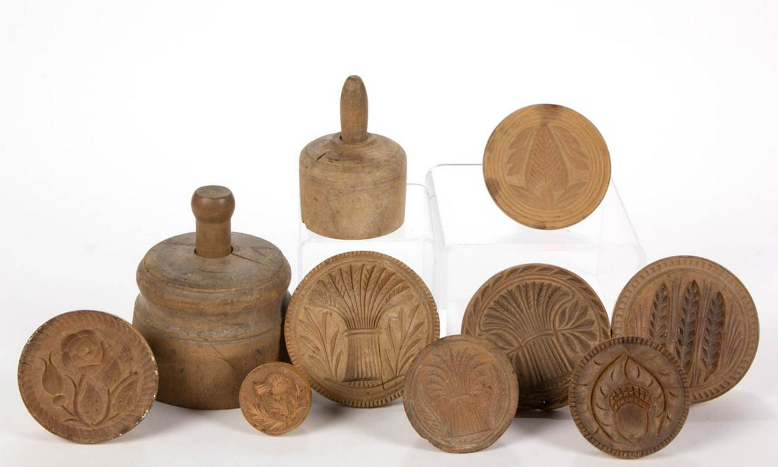 MID-ATLANTIC CARVED TREEN BUTTER PRINTS / MOLDS, LOT OF: MID-ATLANTIC CARVED TREEN BUTTER PRINTS / MOLDS, LOT OF TEN, including thistle-like flower, sheaf of wheat designs, and acorns. Dry natural surface. 19th century. Thistle-like flower 2" D. One mold wi