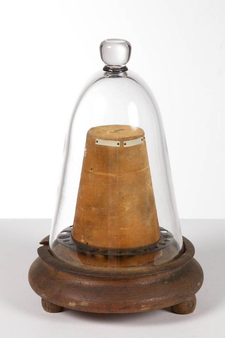 AMERICAN WATCHMAKER'S DOMED TOOL HOLDER: AMERICAN WATCHMAKER'S DOMED TOOL HOLDER, clear glass dome covering, set on wooden base with applied ball feet. 19th century. 10 1/2" HOA.Very good overall condition, old break with associated loss to