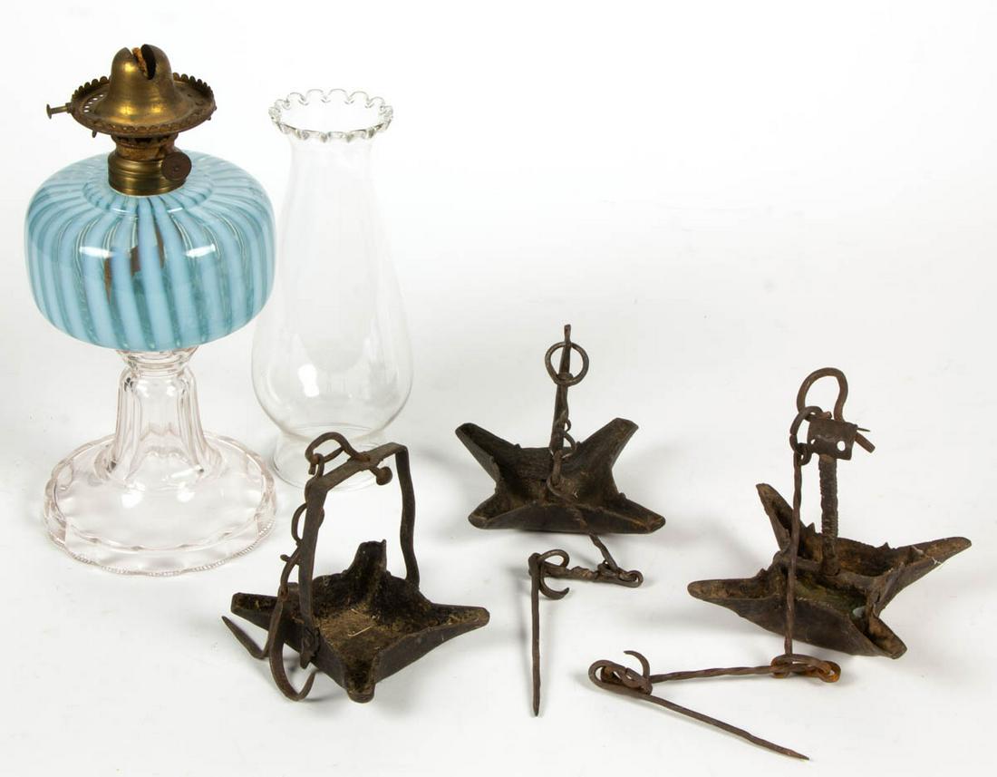 EARLY WROUGHT-IRON HANGING PAN LAMPS, LOT OF THREE: EARLY WROUGHT-IRON HANGING PAN LAMPS, LOT OF THREE, each pendant form with four spouts, original chain and hanging hook. Together with kerosene stand lamp, font attached to standard with epoxy, fitted