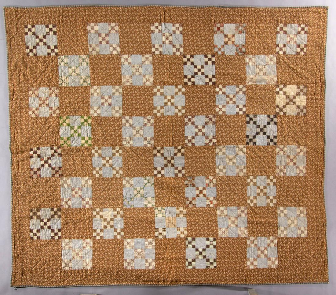 AMERICAN NINE PATCH PIECED QUILT: AMERICAN NINE PATCH PIECED QUILT, hand-stitched, various print fabrics, 36 nine patch blocks constructed from five nine patch squares and four blue print squares, alternating with plain print blocks, 