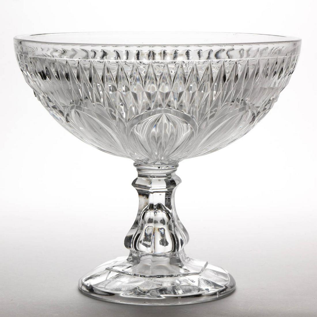 BALLOON AND SPEARPOINT OPEN COMPOTE: BALLOON AND SPEARPOINT OPEN COMPOTE, colorless lead glass, raised on a baluster-form stem and circular foot. Probably Pittsburgh area. Third quarter 19th century. 9 1/2" H, 10 3/4" D rim. Virtually un