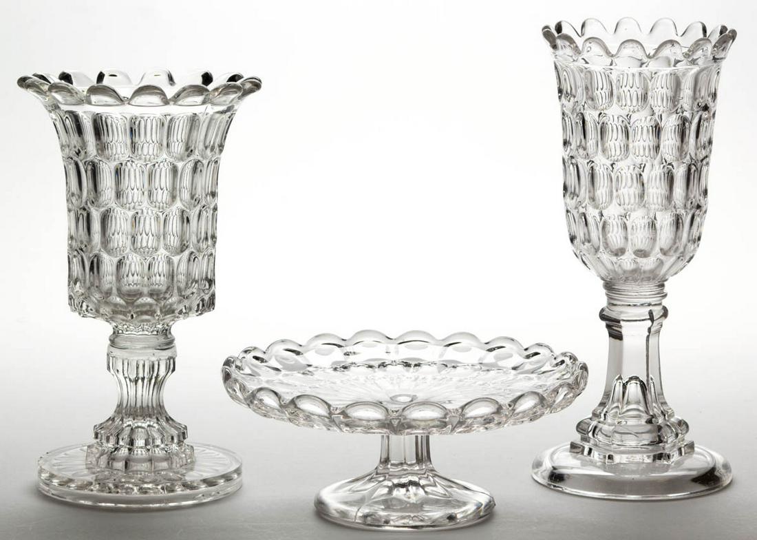 EARLY THUMBPRINT / ARGUS (OMN) TABLE ARTICLES, LOT OF: EARLY THUMBPRINT / ARGUS (OMN) TABLE ARTICLES, LOT OF THREE, colorless lead glass, comprising two celery vases and a short cake stand. Bakewell, Pears & Co., Pittsburgh, PA. Third quarter 19th century