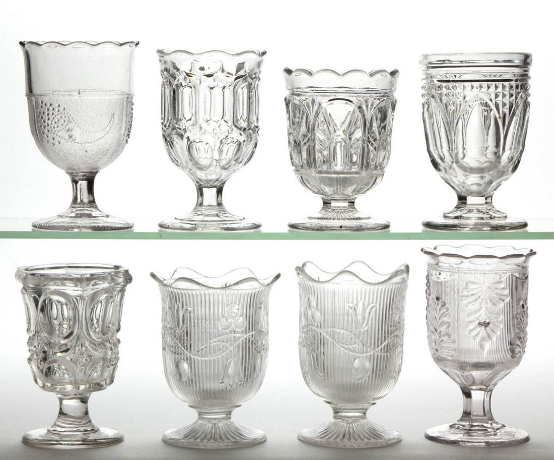 ASSORTED FLINT EAPG SPOON HOLDERS, LOT OF EIGHT: ASSORTED FLINT EAPG SPOON HOLDERS, LOT OF EIGHT, colorless lead glass, including Bellflower - Double Vine, Excelsior, Gothic, Powder and Shot, and Inverted Fern. Boston and Sandwich Glass Co. and othe