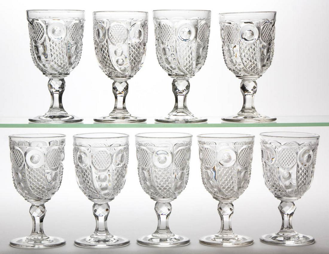 HORN OF PLENTY / COMET (OMN) GOBLETS, LOT OF NINE: HORN OF PLENTY / COMET (OMN) GOBLETS, LOT OF NINE, colorless lead glass. M'Kee & Bros., Boston & Sandwich Glass Co., and probably others. 1850-1870. 6 1/4" H. Undamaged. One example having a single op