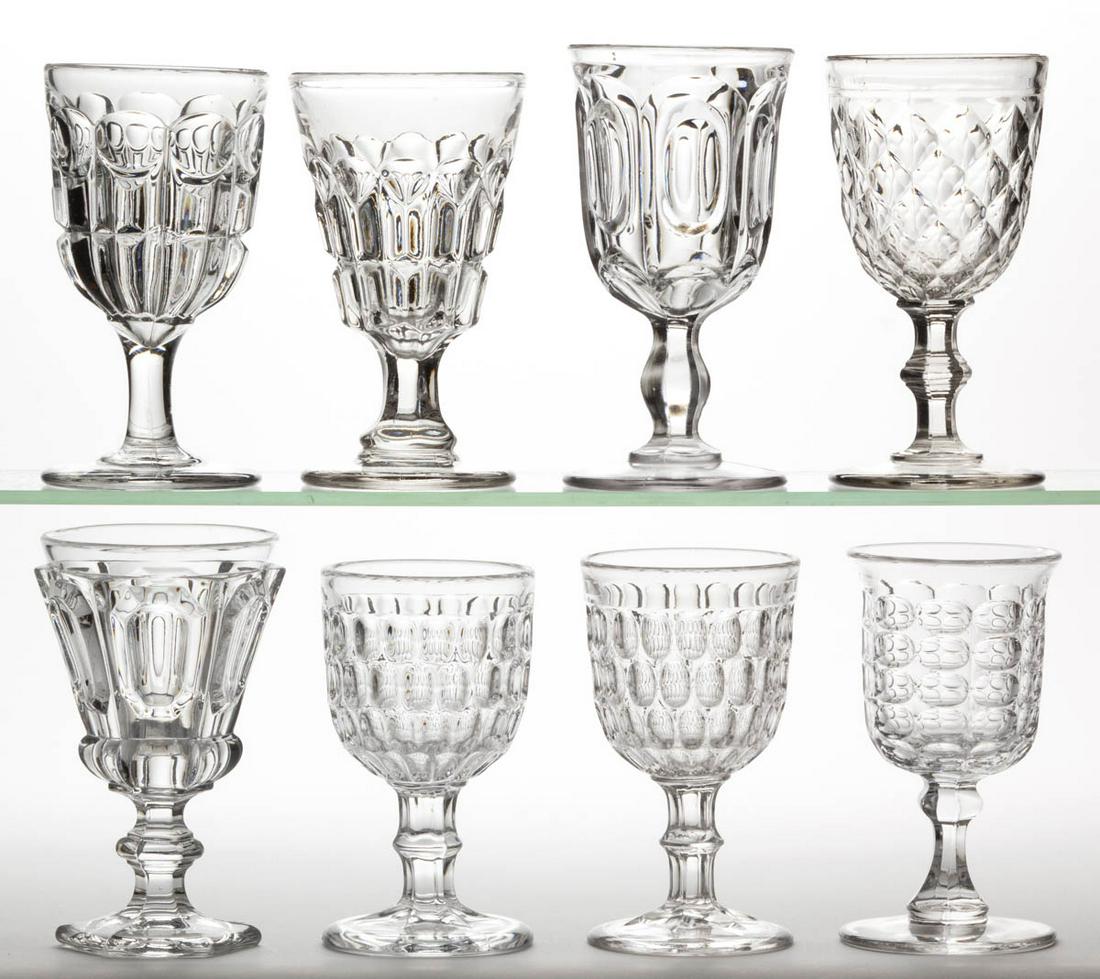 ASSORTED FLINT EAPG GOBLETS, LOT OF EIGHT: ASSORTED FLINT EAPG GOBLETS, LOT OF EIGHT, colorless lead glass, including two Early Thumbprint, a Six-Row Argus, a Bull's Eye and Broken Column, and a Prism and Lobular Loops. Various makers. Third q