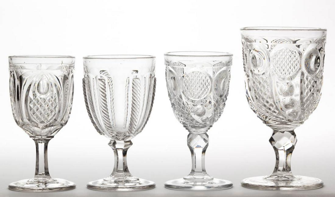ASSORTED FLINT EAPG DRINKING ARTICLES, LOT OF FOUR: ASSORTED FLINT EAPG DRINKING ARTICLES, LOT OF FOUR, colorless lead glass, comprising a Horn of Plenty goblet and champagne, a New England Pineapple champagne, and a Cable champagne. Various makers. Th