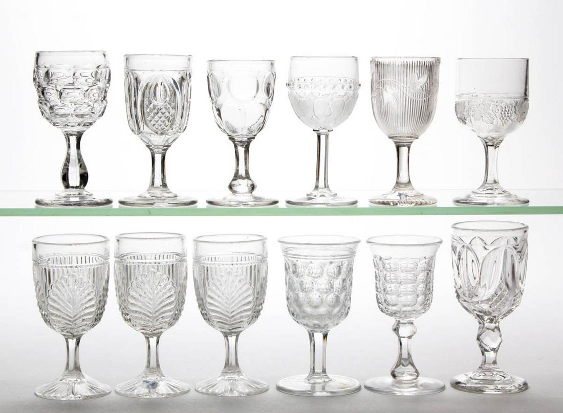 ASSORTED FLINT EAPG WINES, LOT OF 12: ASSORTED FLINT EAPG WINES, LOT OF 12, colorless lead glass, including Argus - Five Row, Argus - Bulb Stem, Round Thumbprint, New England Pineapple, three Ribbed Palm, and Tulip with Sawtooth. Various 