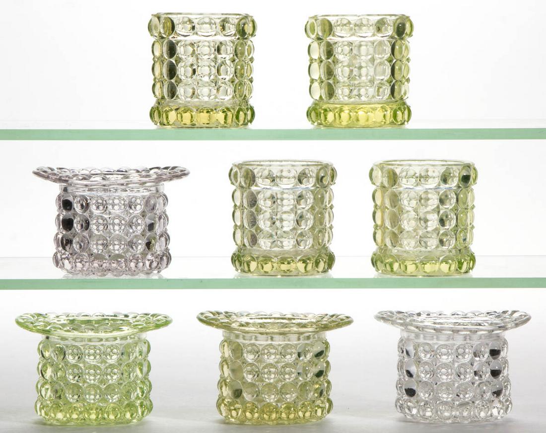 THOUSAND EYE / ADAMS NO. 130 SENSATION (OMN) TOOTHPICK: THOUSAND EYE / ADAMS NO. 130 SENSATION (OMN) TOOTHPICK HOLDERS, LOT OF EIGHT, colorless and Vaseline (reacts under black light), including four hat-form examples. Adams & Co. Circa 1891. 2 1/4" to 2 3