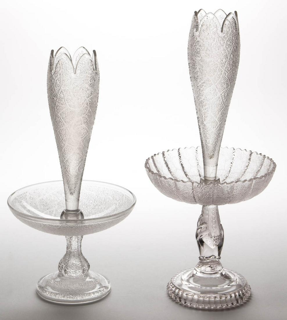 ASSORTED TREE OF LIFE EPERGNES, LOT OF TWO: ASSORTED TREE OF LIFE EPERGNES, LOT OF TWO, colorless, comprising a Portland example with pattern stopping before it reaches the rim and being embossed "P.C.CO./PATENT" to the top of the foot, and a H