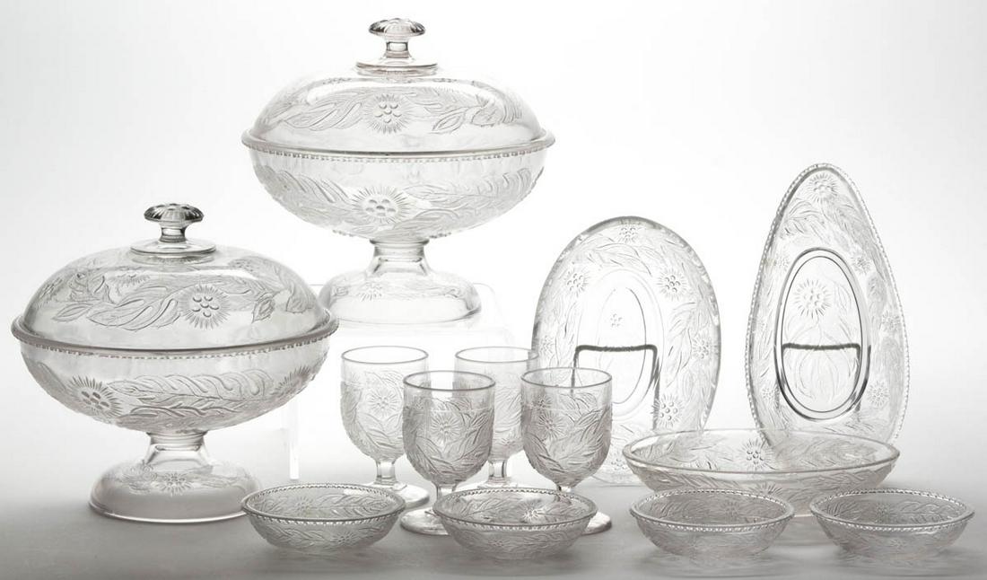WINDFLOWER TABLE ARTICLES, LOT OF 13: WINDFLOWER TABLE ARTICLES, LOT OF 13, colorless, including two open compotes, a pickle/relish dish, and four egg cups. Maker unverified. Circa 1878. 1 1/4" to 8" HOA. 8 1/2" D compote rims. One compot