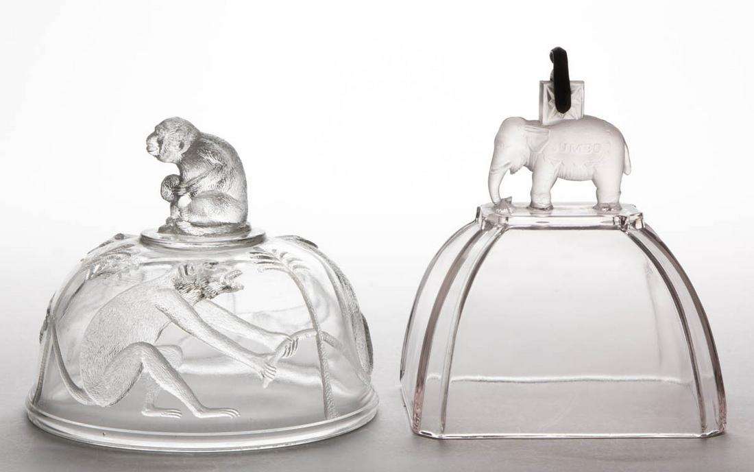 ASSORTED ANIMAL EAPG COVERS, LOT OF TWO: ASSORTED ANIMAL EAPG COVERS, LOT OF TWO, colorless, comprising a Canton Jumbo cheese dish cover with the original metal hanger, and a Monkey butter dish cover. Various makers. Fourth quarter 19th/firs