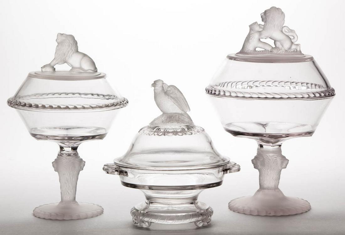 ASSORTED EAPG TABLE ARTICLES, LOT OF THREE: ASSORTED EAPG TABLE ARTICLES, LOT OF THREE, frosted and colorless, comprising a Frosted Eagle covered butter dish, and two Frosted Lion covered compotes. Various makers. Fourth quarter 19th century. 7