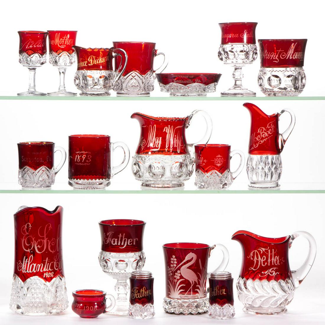 ASSORTED EAPG - RUBY-STAINED ARTICLES, LOT OF 19: ASSORTED EAPG - RUBY-STAINED ARTICLES, LOT OF 19, colorless with engraved/souvenir decoration, including five King's Crown articles, a Pavonia mug with decoration depicting a stork standing in a pond,