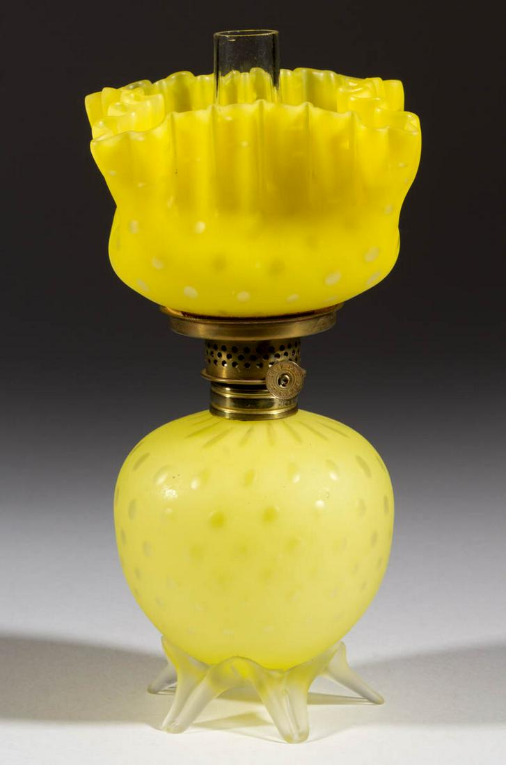 RAINDROP AIR-TRAP MOTHER-OF-PEARL SATIN MINIATURE LAMP: RAINDROP AIR-TRAP MOTHER-OF-PEARL SATIN MINIATURE LAMP, cased lemon yellow, elongated-form font, colorless and frosted applied base with five raised toes, slightly darker matching pattern square-form 