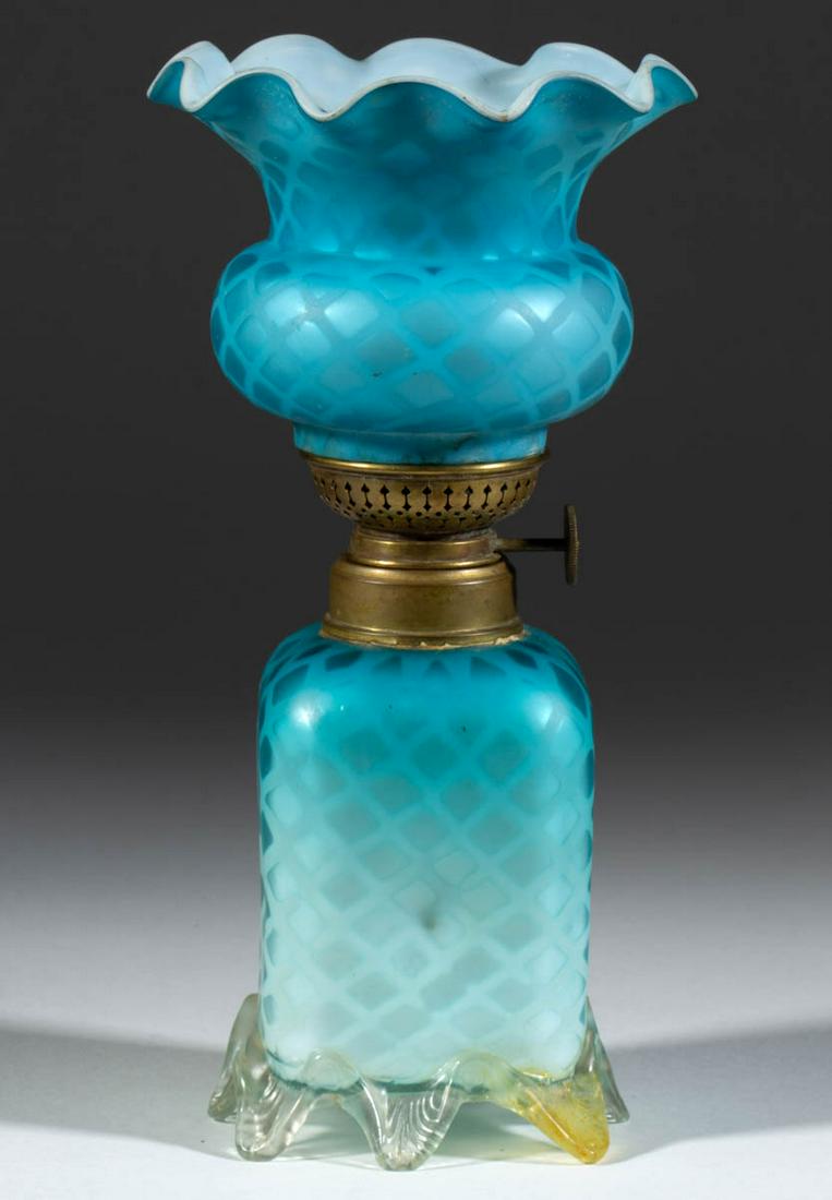 DIAMOND QUILT AIR-TRAP MOTHER-OF-PEARL SATIN MINIATURE: DIAMOND QUILT AIR-TRAP MOTHER-OF-PEARL SATIN MINIATURE LAMP, cased dark to light blue, square-form font with a dimple on each side, colorless applied base with eight raised toes, each with feathered p