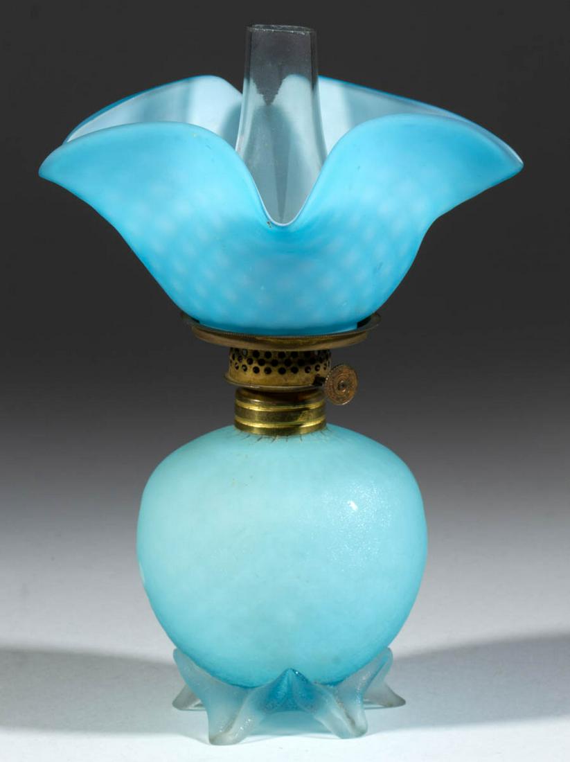 CUT VELVET DIAMOND QUILTED ART GLASS MINIATURE LAMP: CUT VELVET DIAMOND QUILTED ART GLASS MINIATURE LAMP, cased blue with satin finish, elongated ball-form font, colorless with satin finish applied base raised on five toes, darker blue and matching patt