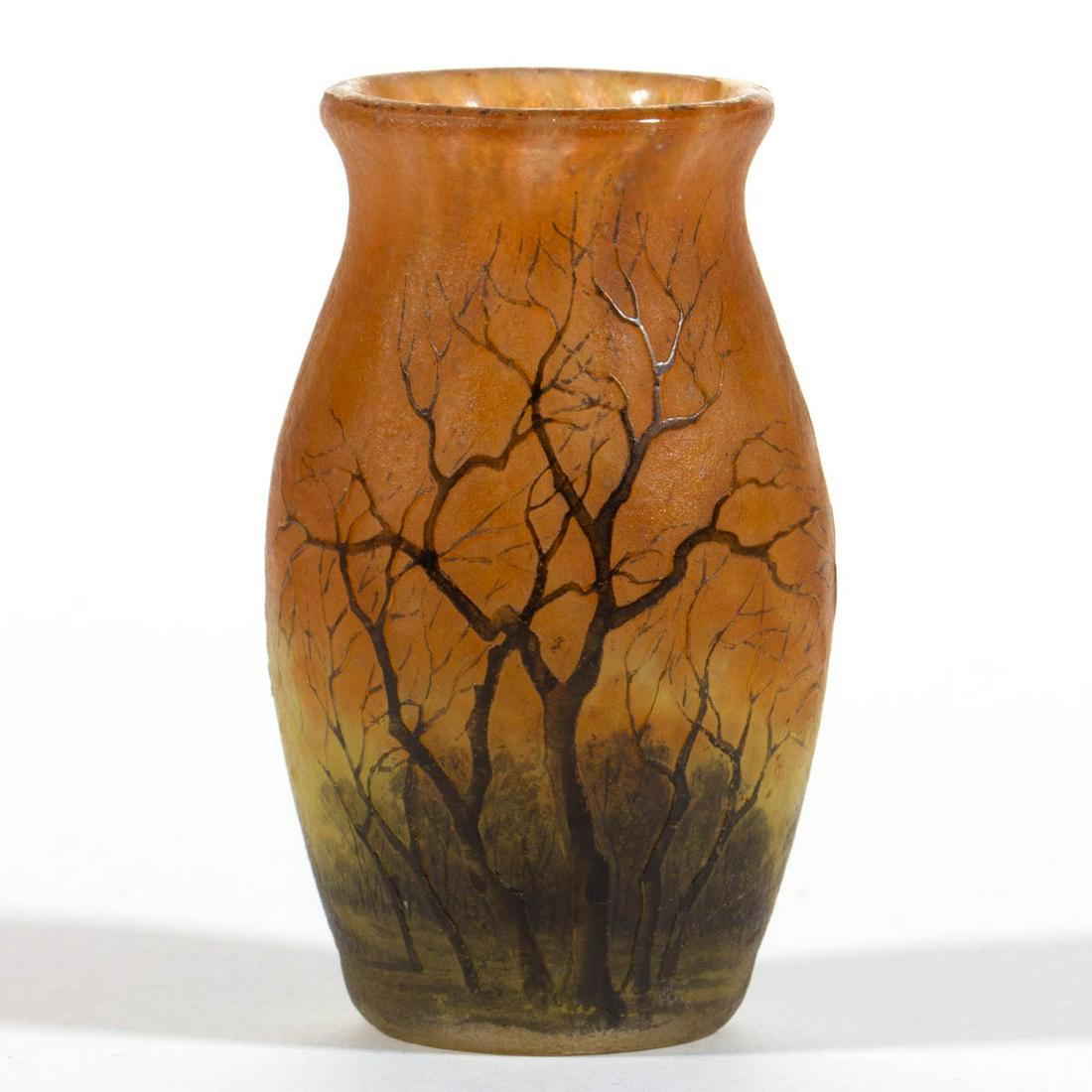 DAUM NANCY WINTER CAMEO ART GLASS CABINET VASE: DAUM NANCY WINTER CAMEO ART GLASS CABINET VASE, mottled amber ground with brown and white enamel decoration, ovoid form, polished base, signed "Daum/Nancy". France. Late 19th/early 20th century. 2 7/8