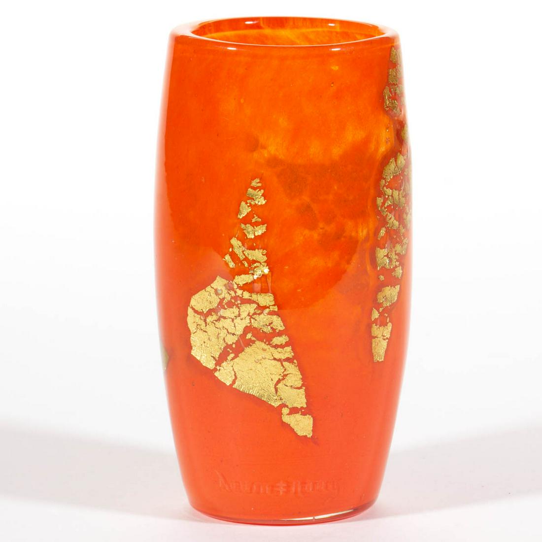 DAUM MOTTLED ART GLASS VASE: DAUM MOTTLED ART GLASS VASE, colorless with heavy orange mottling, slightly bulged cylindrical form with applied gold leaf decoration, engraved "DAUM/NANCY" with the Cross of Lorraine, polished pontil