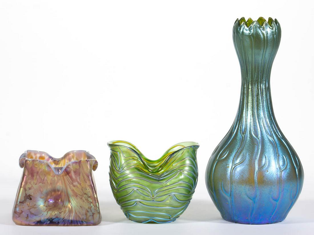ASSORTED BOHEMIAN ART GLASS ARTICLES, LOT OF THREE: ASSORTED BOHEMIAN ART GLASS ARTICLES, LOT OF THREE, comprising a green iridescent Loetz Neptune, a green iridescent Loetz Formosa, and a Kralik amethyst and gold mottled Bacillus square dish. Bohemia,