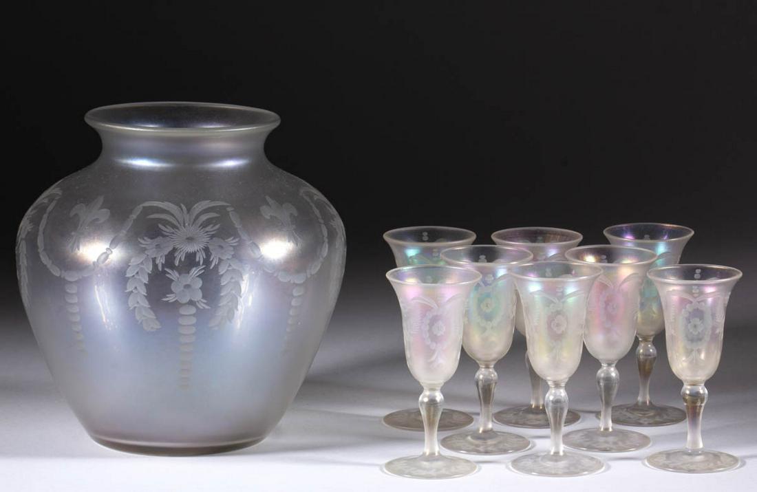 STEUBEN VERRE DE SOIE ART GLASS ARTICLES, LOT OF NINE: STEUBEN VERRE DE SOIE ART GLASS ARTICLES, LOT OF NINE, colorless iridescent, comprising an urn-form vase with fleur-de-lis and floral draped engraved decoration, and eight wines with matching floral m