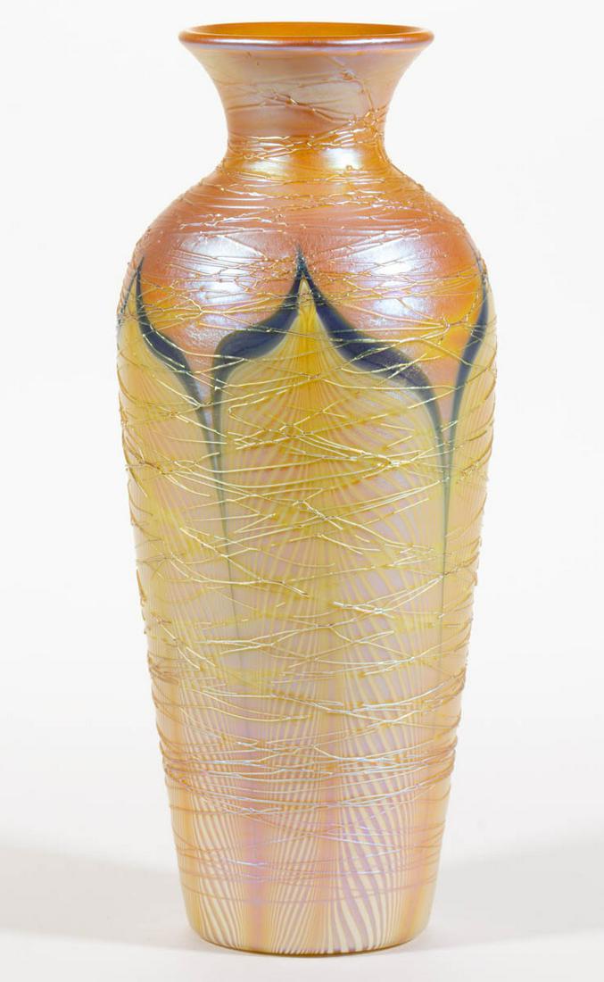 DURAND PULLED FEATHER ART GLASS VASE: DURAND PULLED FEATHER ART GLASS VASE, golden iridescent with blue and opal decoration, urn form with golden iridescent spider webbing, polished pontil mark, unsigned. Vineland Flint Glass Works. 1924-