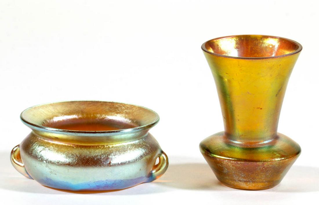 ASSORTED AMERICAN IRIDESCENT ART GLASS ARTICLES, LOT OF: ASSORTED AMERICAN IRIDESCENT ART GLASS ARTICLES, LOT OF TWO, comprising a signed Tiffany cauldron open salt, and a toothpick holder with a compressed base. First quarter 20th century. 1" and 2 1/4" H.