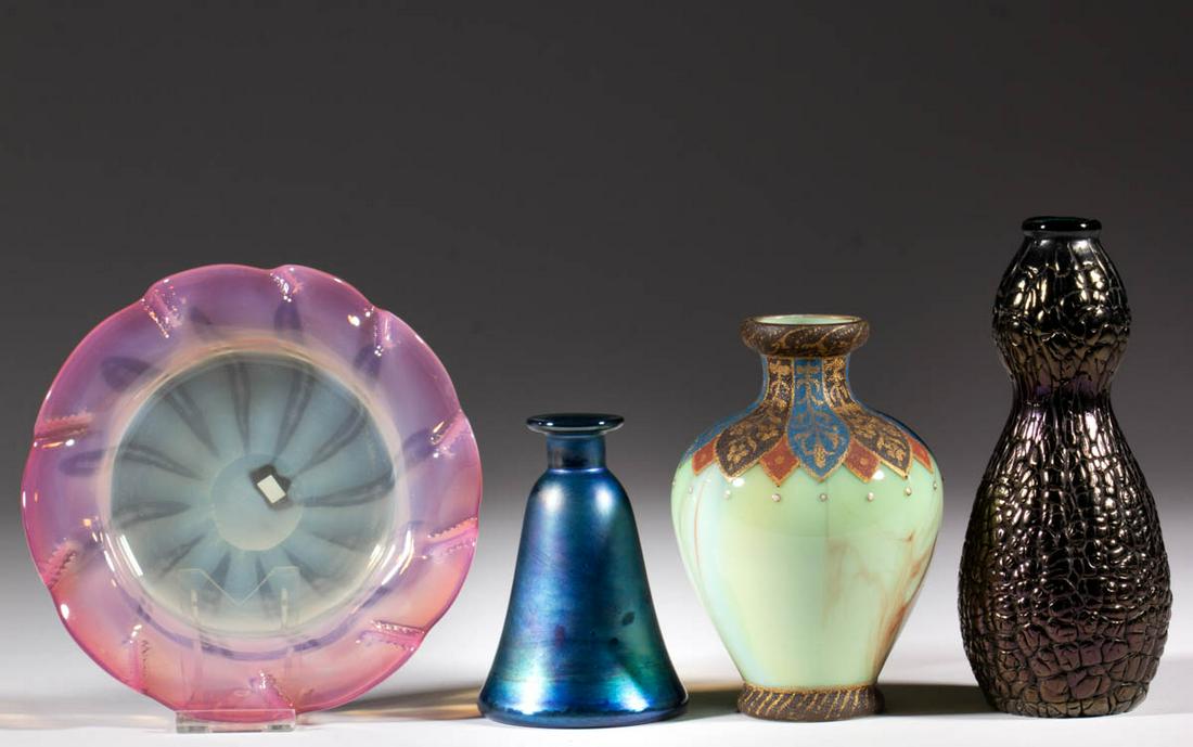 ASSORTED ART GLASS ARTICLES, LOT OF FOUR: ASSORTED ART GLASS ARTICLES, LOT OF FOUR, comprising a Steuben blue Aurene perfume bottle, a Tiffany Favrile pastel dish, a green and maroon Loetz Marbleized vase with enamel-decoration, and an irides
