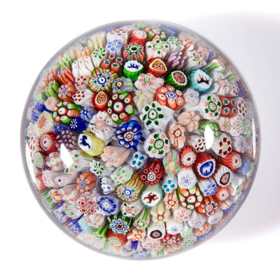 ANTIQUE BACCARAT "B / 1847" SILHOUETTE AND MILLEFIORI: ANTIQUE BACCARAT "B / 1847" SILHOUETTE AND MILLEFIORI PAPERWEIGHT, colorless, with close-packed complex millefiori canes including arrowheads and shamrocks, and arrows, and scattered silhouette canes 
