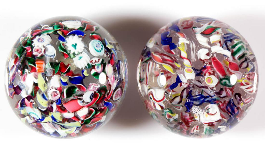 ANTIQUE AMERICAN SCRAMBLED PAPERWEIGHTS, LOT OF TWO: ANTIQUE AMERICAN SCRAMBLED PAPERWEIGHTS, LOT OF TWO, colorless, each having scattered filigree and opaque twists with scattered millefiori canes, each having a polished pontil mark. Probably Boston & 