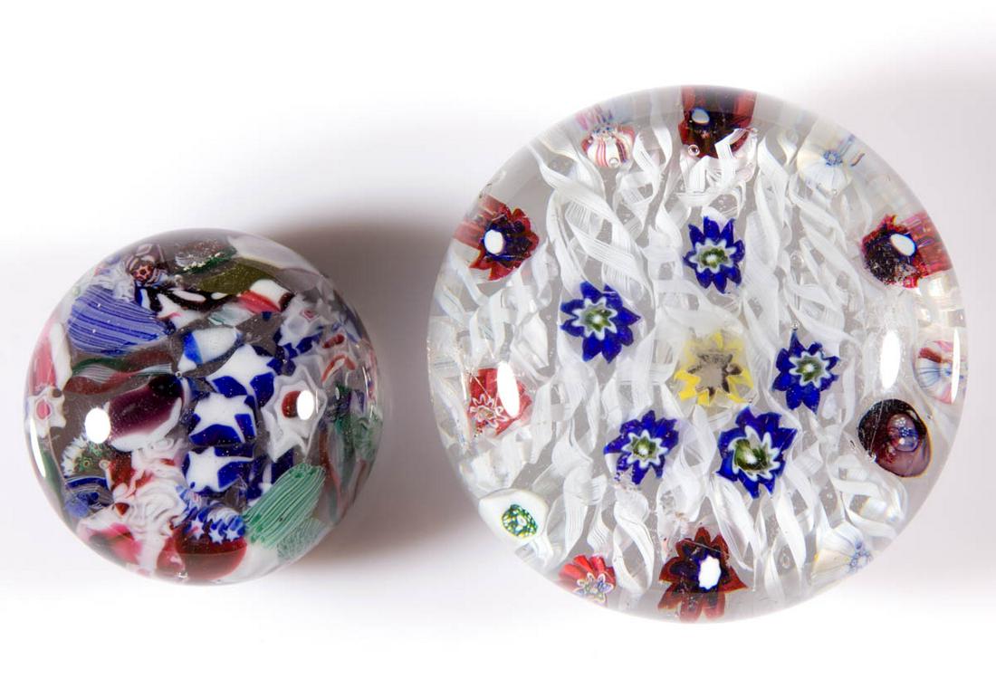 ANTIQUE EUROPEAN SCRAMBLED PAPERWEIGHTS, LOT OF TWO: ANTIQUE EUROPEAN SCRAMBLED PAPERWEIGHTS, LOT OF TWO, colorless, comprising one with star and other assorted millefiori canes, other having a bed of filigree twists supporting scattered floral millefio
