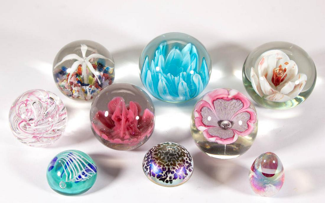 ASSORTED GLASS PAPERWEIGHTS, LOT OF NINE: ASSORTED GLASS PAPERWEIGHTS, LOT OF NINE, colorless, including a signed "LANGHAM/ENGLAND" swirled, a signed Wilson "Aquarium", an Ars Vitraria iridescent mushroom, and a Hamon floral. Various makers. 