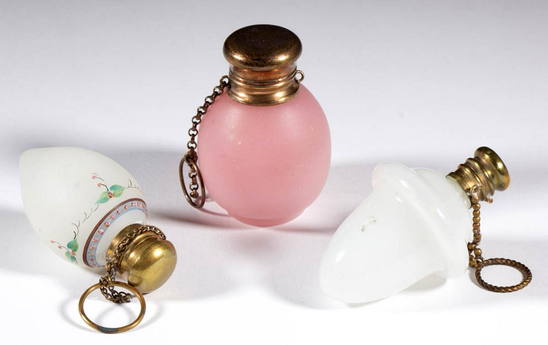 ASSORTED TRANSLUCENT GLASS SCENT BOTTLES, LOT OF THREE: ASSORTED TRANSLUCENT GLASS SCENT BOTTLES, LOT OF THREE, alabaster/clambroth and translucent pink/rose, comprising an acorn-form, ovoid form, and teardrop form having polychrome-enamel decoration, each