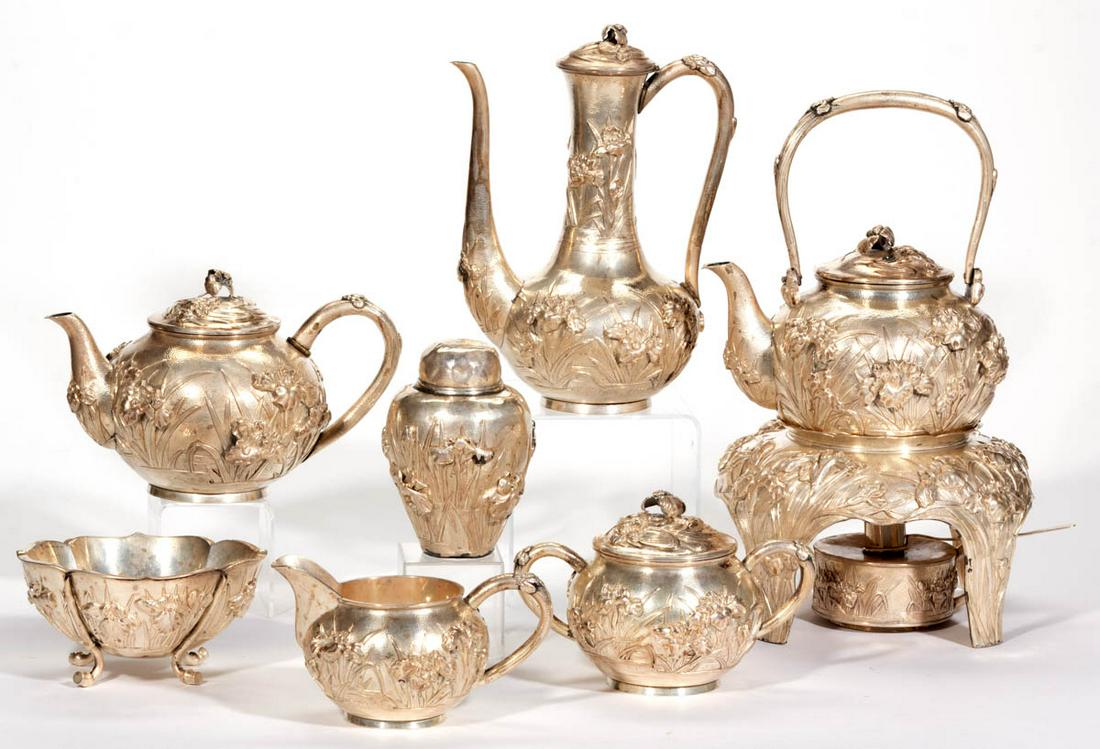 JAPANESE EXPORT MEIJI PERIOD SILVER SEVEN-PIECE COFFEE: JAPANESE EXPORT MEIJI PERIOD SILVER SEVEN-PIECE COFFEE AND TEA SERVICE, comprising a coffee pot, a teapot, a tea kettle on an unattached stand with a burner having a snuffer, a tea caddy, a creamer, a