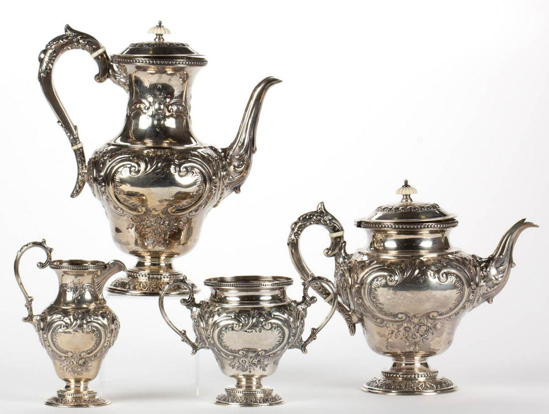 ENGLISH REPOUSSE AND CHASED STERLING SILVER FOUR-PIECE: ENGLISH REPOUSSE AND CHASED STERLING SILVER FOUR-PIECE COFFEE AND TEA SERVICE, comprising a coffee pot, a teapot, a creamer, and an open sugar, each having a beaded rim, ornate repousse and chased dec
