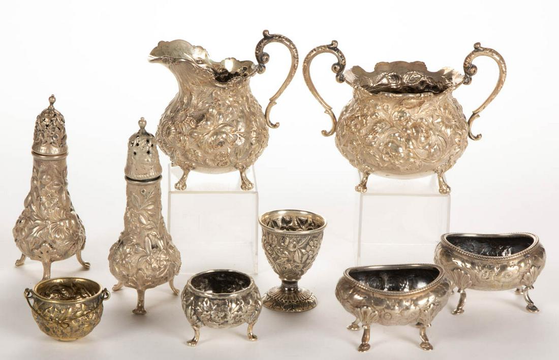 ASSORTED REPOUSSE STERLING AND OTHER SILVER TABLE: ASSORTED REPOUSSE STERLING AND OTHER SILVER TABLE ARTICLES, LOT OF NINE, comprising a sterling creamer and open sugar set in the "Rose" pattern by The Stieff Co. of Baltimore, MD, a shaker of unknown 