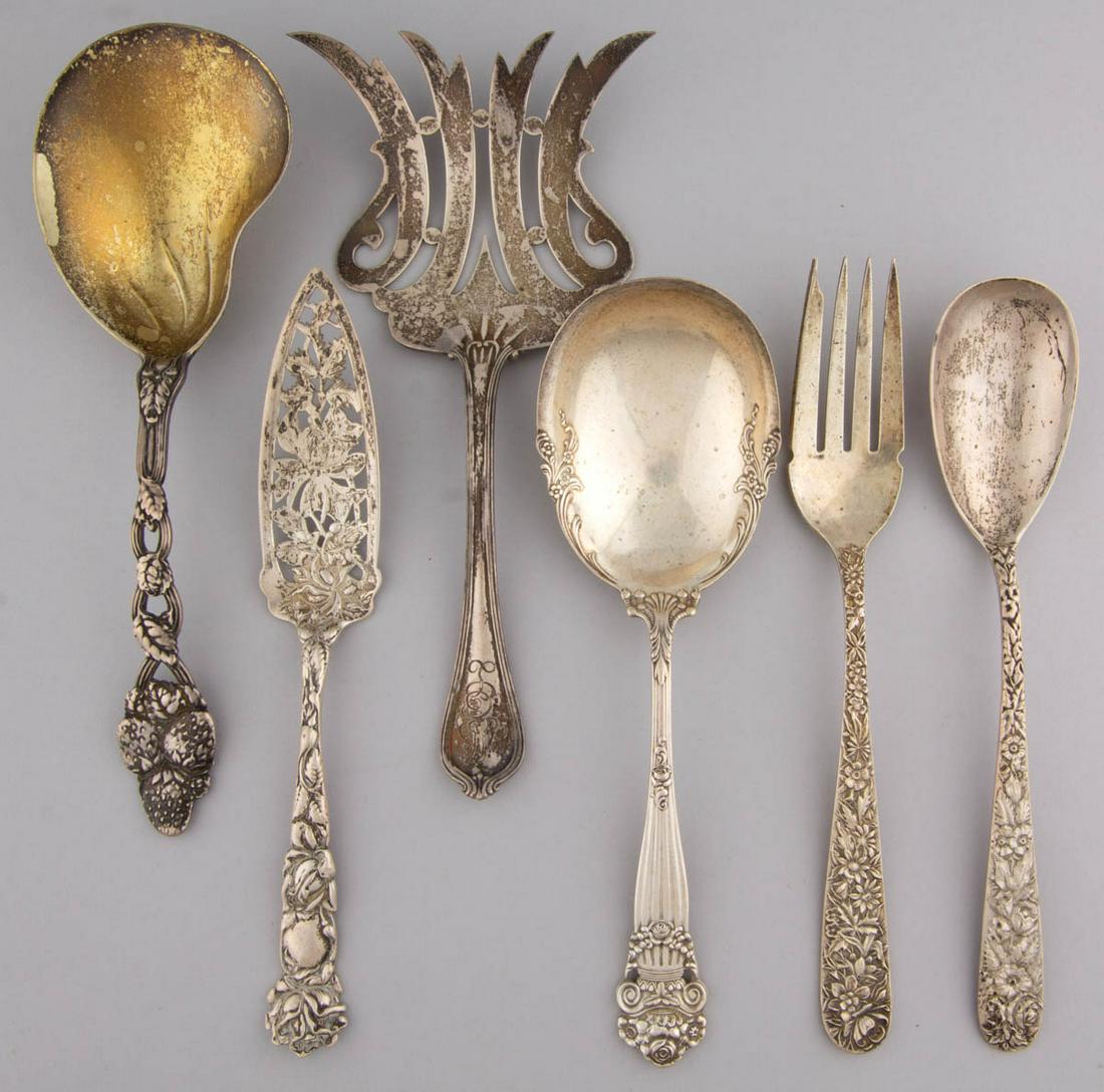 TIFFANY & CO. AND OTHER AMERICAN STERLING SILVER: TIFFANY & CO. AND OTHER AMERICAN STERLING SILVER SERVING UTENSILS, LOT OF SIX, comprising a "Strawberry Pierced" berry/casserole spoon by Tiffany & Co., a meat fork and a serving spoon in the "Repouss