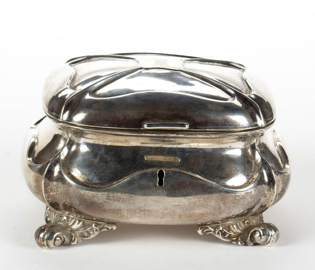 KAROL FILIP MALCZ POLISH 0.875 SILVER SUGAR BOX: KAROL FILIP MALCZ POLISH 0.875 SILVER SUGAR BOX, rectangular form with repousse detailing, having a hinged lid with engraved shield and crown to center, gold-washed interior, and a key hole to front o