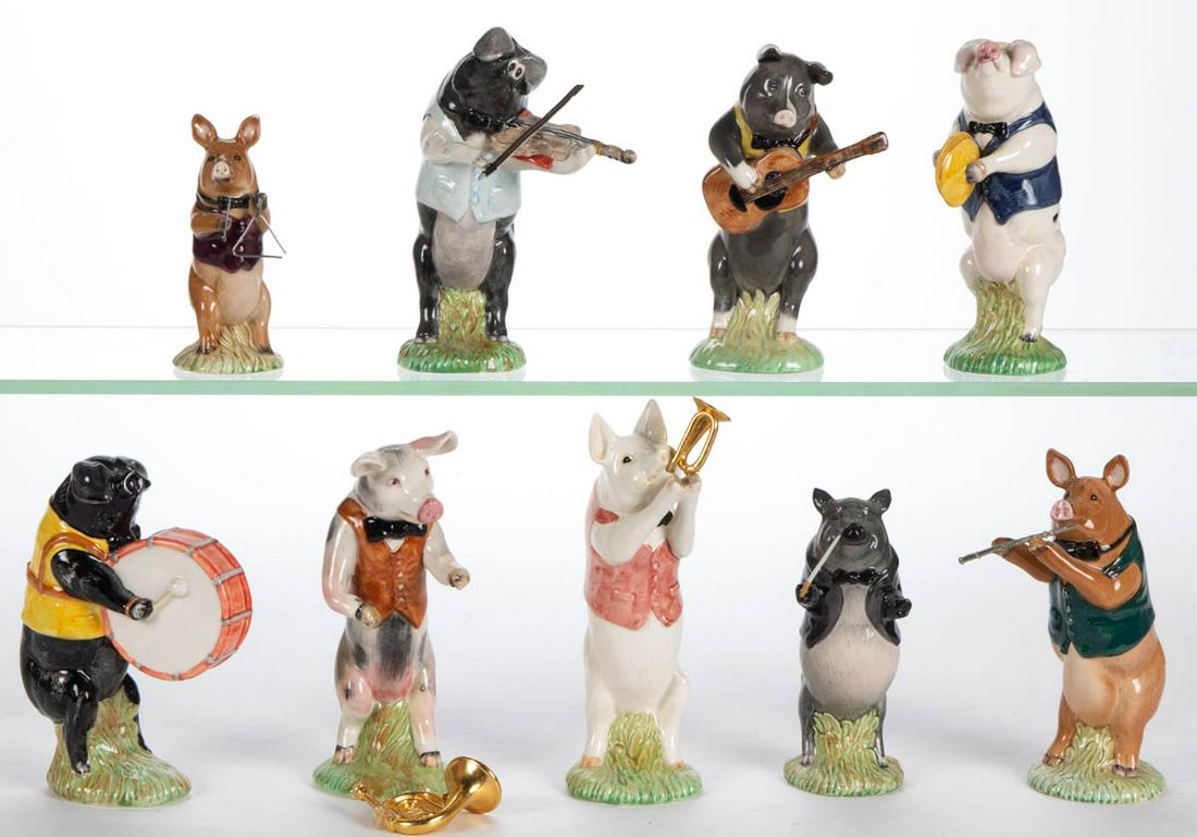 ENGLISH BESWICK PORCELAIN NINE-PIECE "PIG PROMENADE: ENGLISH BESWICK PORCELAIN NINE-PIECE "PIG PROMENADE BAND" FIGURES, each standing on an oval green grass base, comprising "John" the director, "James" the triangle player, "Daniel" on violin, "David" p