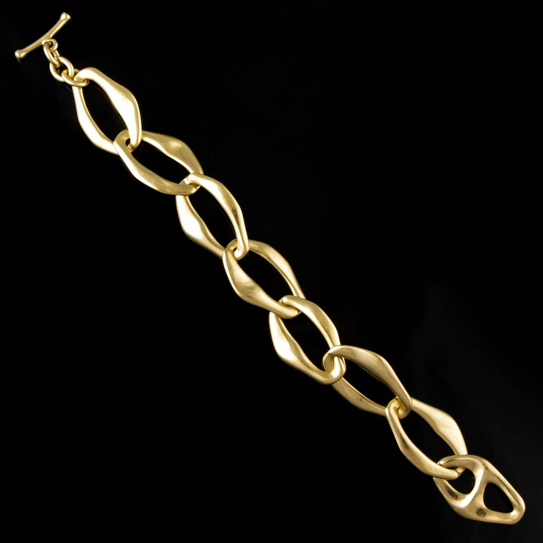 ELSA PERETTI FOR TIFFANY & CO. 18K YELLOW GOLD "AEGEAN": ELSA PERETTI FOR TIFFANY & CO. 18K YELLOW GOLD "AEGEAN" BRACELET, having eight large stylized oval links, toggle clasp. Marked "TIFFANY & CO. (c) ELSA PERITTI 750 SPAIN". Total weight: 42.0 dwt. Late 