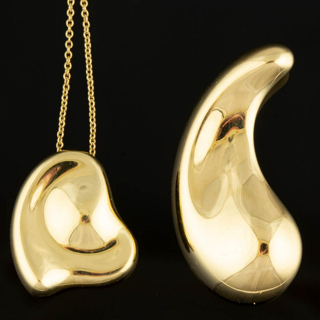 ELSA PERETTI FOR TIFFANY & CO. 18K YELLOW GOLD JEWELRY: ELSA PERETTI FOR TIFFANY & CO. 18K YELLOW GOLD JEWELRY ARTICLES, LOT OF TWO, comprising a "Teardrop" brooch/pin and a "Full Heart" pendant on a cable necklace chain, including a Tiffany & Co. blue clo