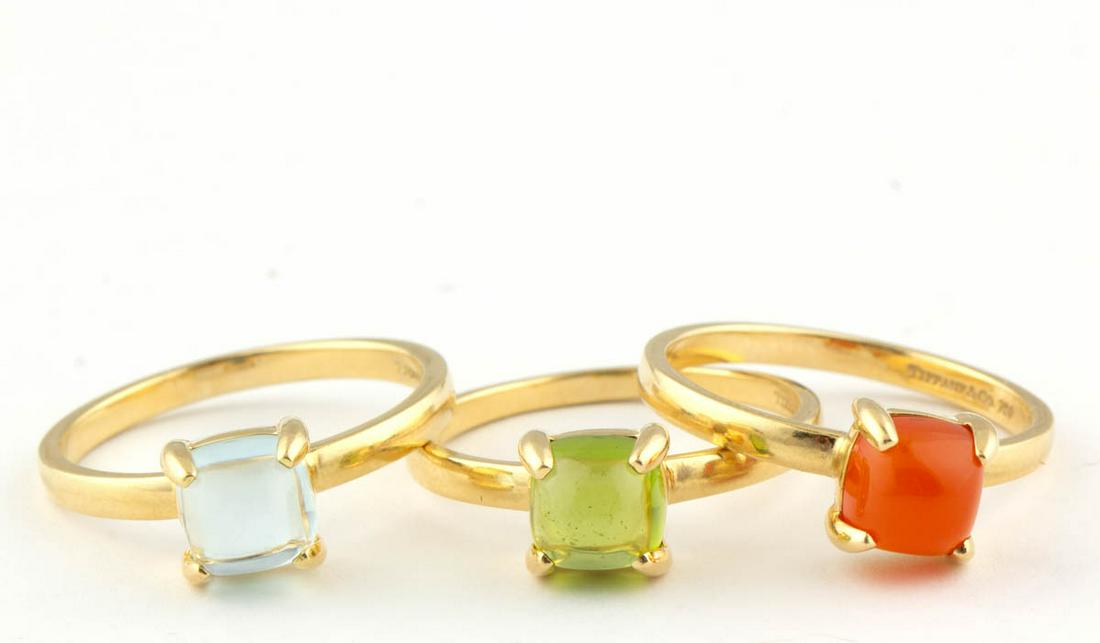 PALOMA PICASSO FOR TIFFANY & CO. 18K YELLOW GOLD AND: PALOMA PICASSO FOR TIFFANY & CO. 18K YELLOW GOLD AND GEMSTONE "SUGAR STACKS" RINGS, LOT OF THREE, each having a 7 mm square stone cabochon in four-prong setting on a plain band, stones comprising a ca