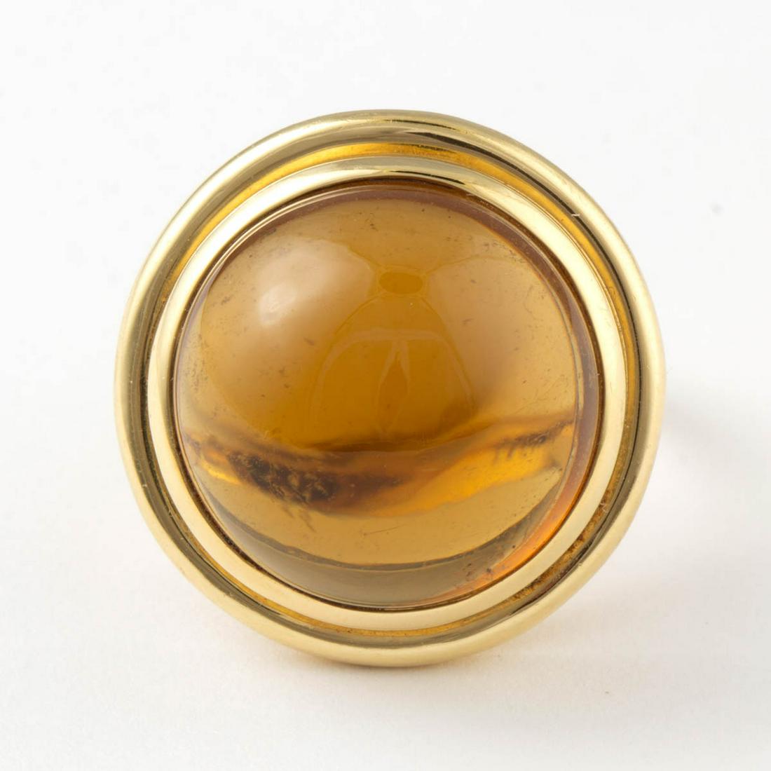 PALOMA PICASSO FOR TIFFANY & CO. 18K YELLOW GOLD AND: PALOMA PICASSO FOR TIFFANY & CO. 18K YELLOW GOLD AND CITRINE RING, having a large 19 mm round citrine cabochon in bezel setting on split-shank band, including a Tiffany & Co. blue cloth pouch. Interio