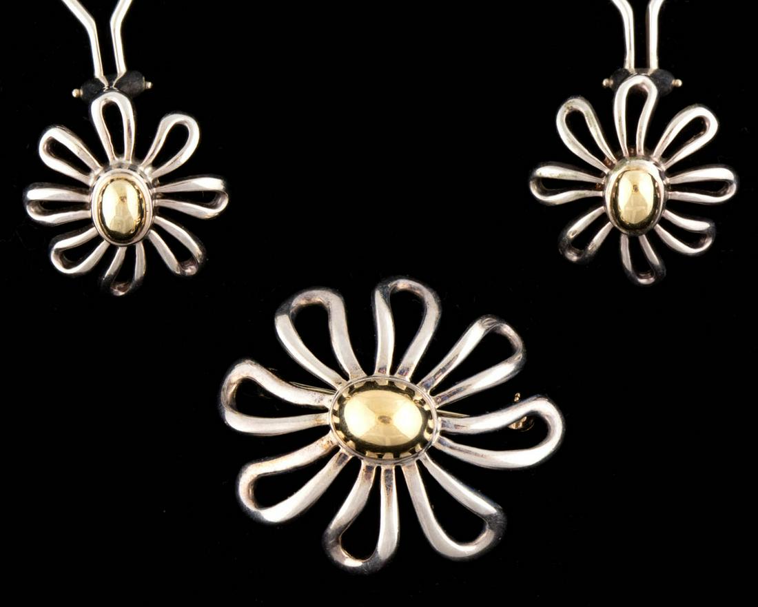 PALOMA PICASSO FOR TIFFANY & CO. STERLING SILVER AND: PALOMA PICASSO FOR TIFFANY & CO. STERLING SILVER AND 18K YELLOW GOLD DAISY FLOWER JEWELRY SUITE, LOT OF THREE, each floret form with openwork petals and a domed center, comprising a pin/brooch and a p