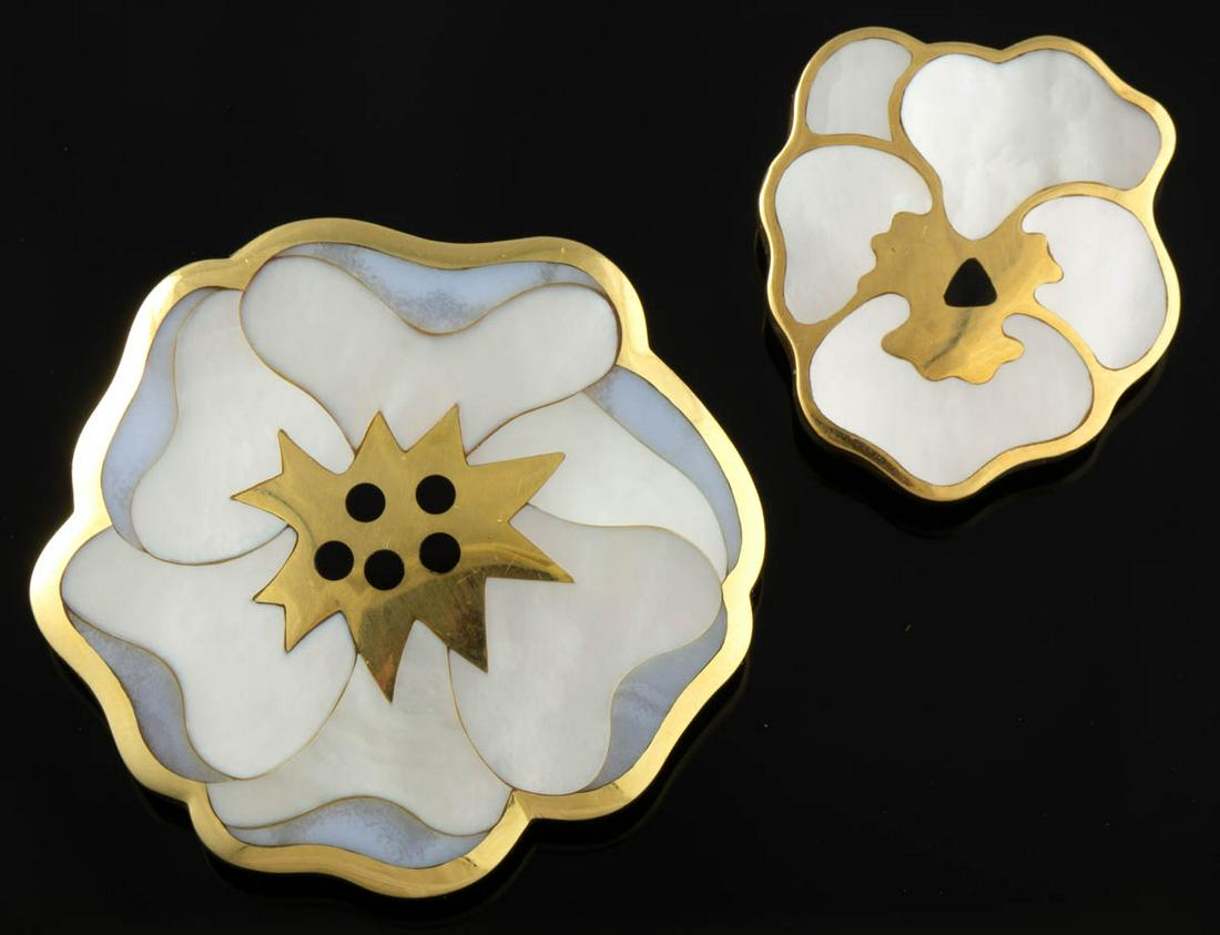 ANGELA CUMMINGS FOR TIFFANY & CO. 18K YELLOW GOLD,: ANGELA CUMMINGS FOR TIFFANY & CO. 18K YELLOW GOLD, ONYX, AND MOTHER-OF-PEARL FLORAL PINS / BROOCHES, LOT OF TWO, each floriform having mother-of-pearl inlaid petals with onyx pistil/stamen, comprising