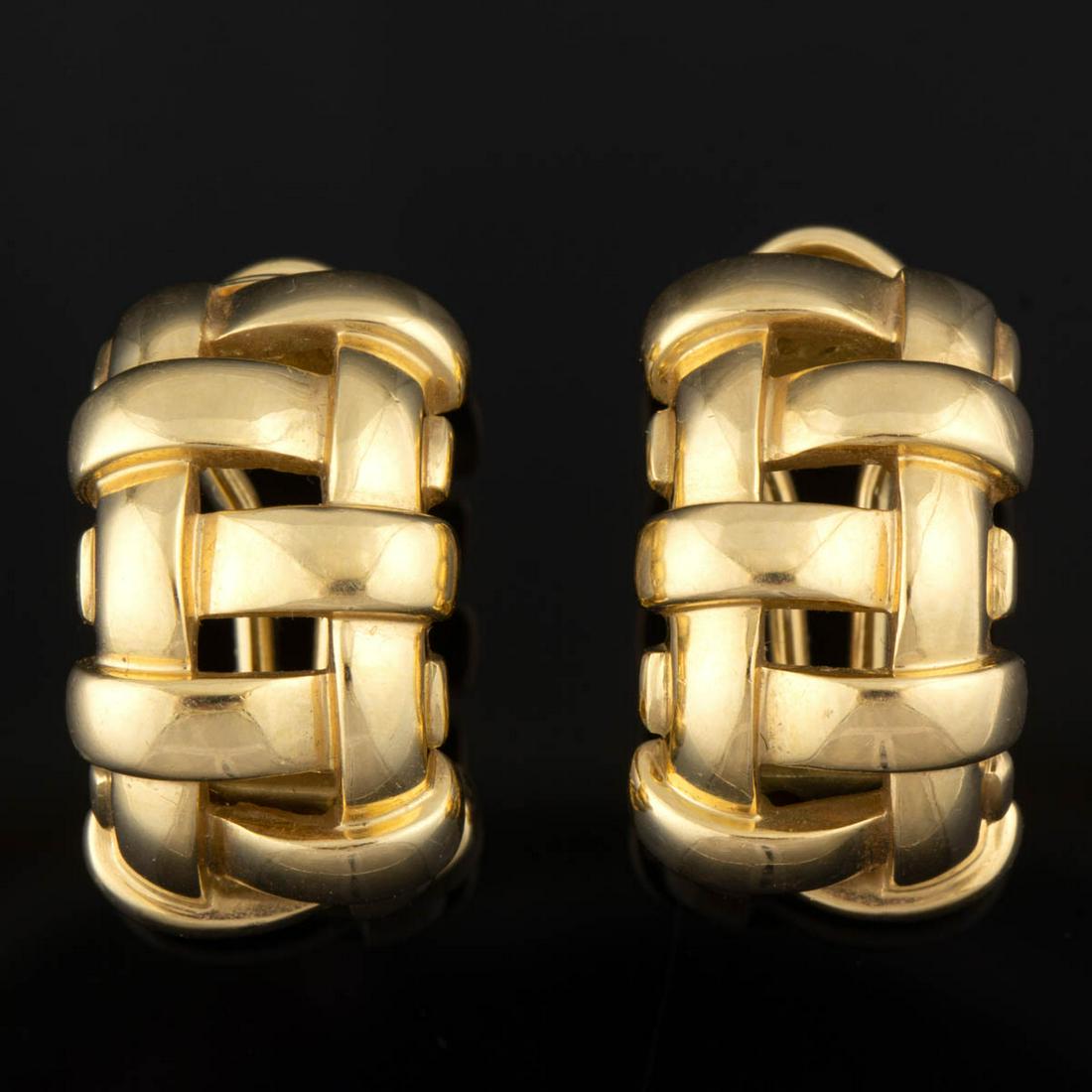 TIFFANY & CO. 18K YELLOW GOLD "VANNERIE BASKET WEAVE": TIFFANY & CO. 18K YELLOW GOLD "VANNERIE BASKET WEAVE" EARRINGS, PAIR, each half-hoop form having post back with omega clip fastener. Each marked "(c) 2002 T&CO. / 750 ITALY". Total weight: 11.5 dwt. 2