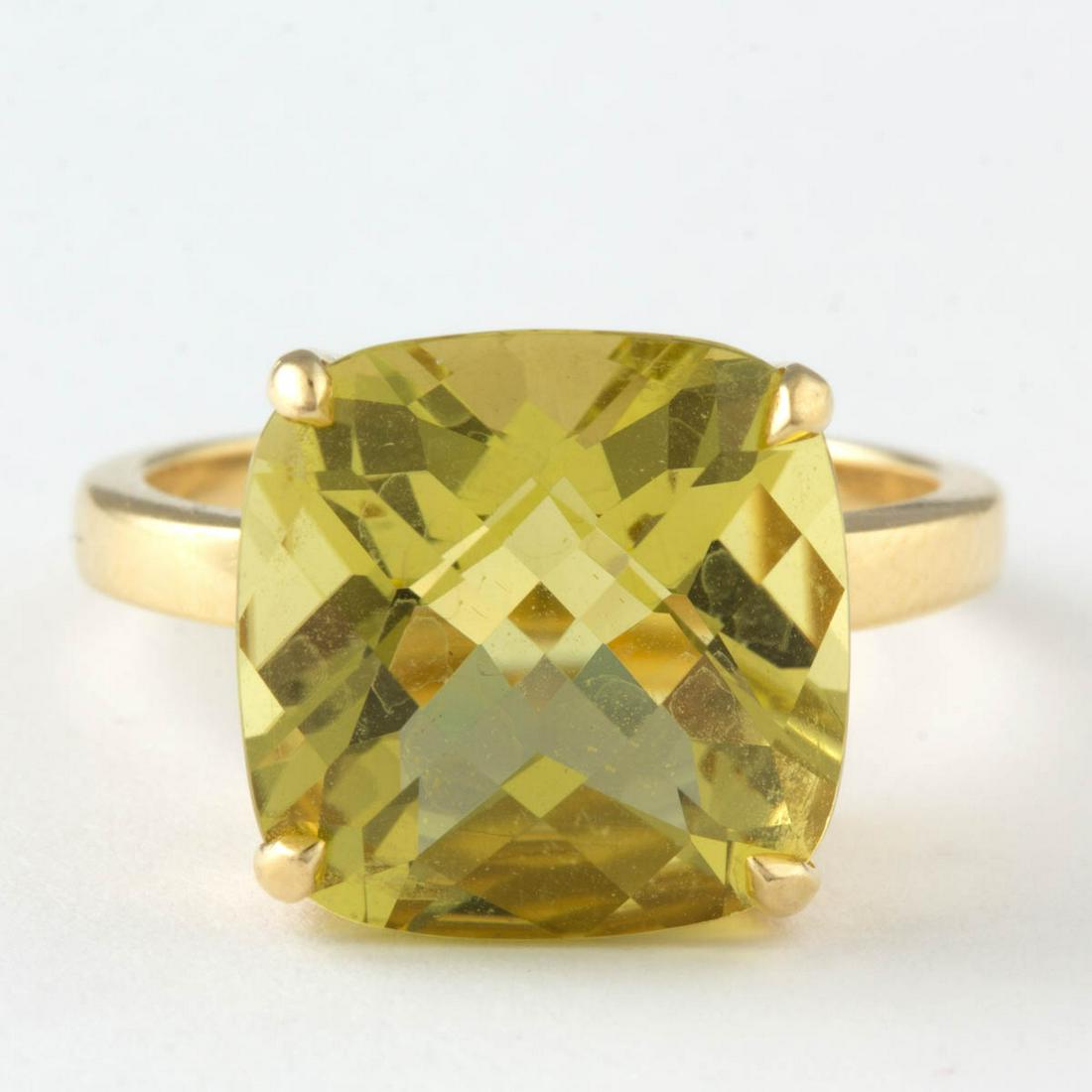 TIFFANY & CO. 18K YELLOW GOLD AND CITRINE SOLITAIRE: TIFFANY & CO. 18K YELLOW GOLD AND CITRINE SOLITAIRE RING, having a 14 x 14 mm checkerboard-cut lemon citrine in four-prong setting on a plain band. Interior band marked "(c) TIFFANY & CO. 750". Total 